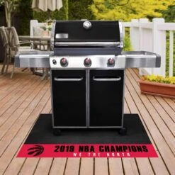 FanMats® 25323 - NBA "Toronto Raptors" 26" X 42" Grill Mat With "2019 NBA Finals Champions" Logo
